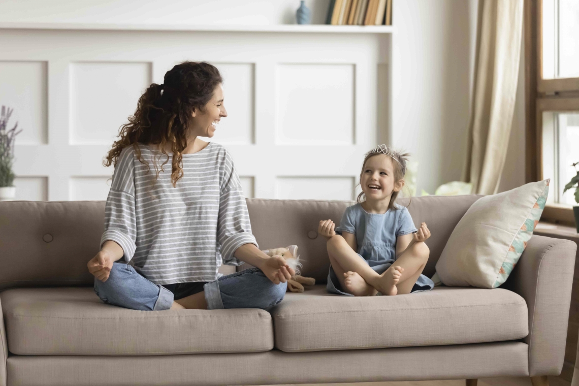 Mom and child practicing yoga