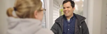 Service professional welcomed by homeowner